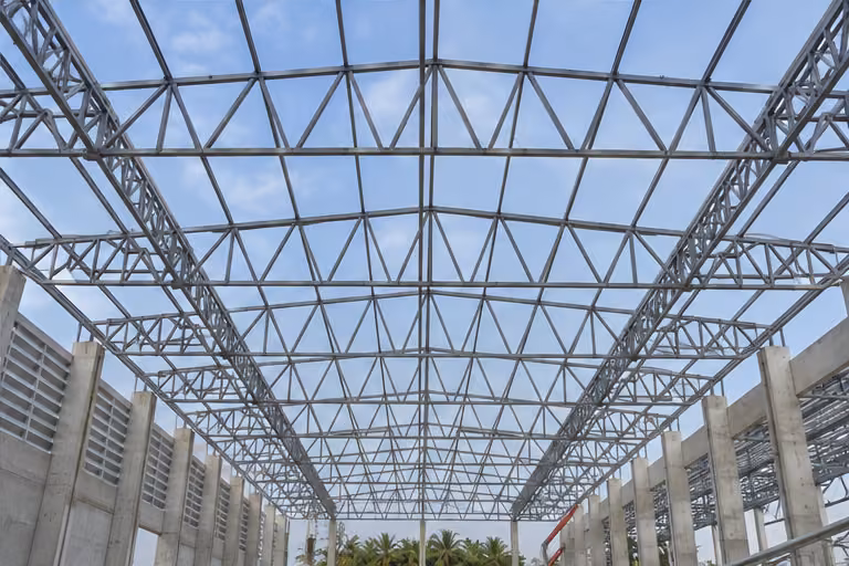 Steel roof trusses above an industrial building