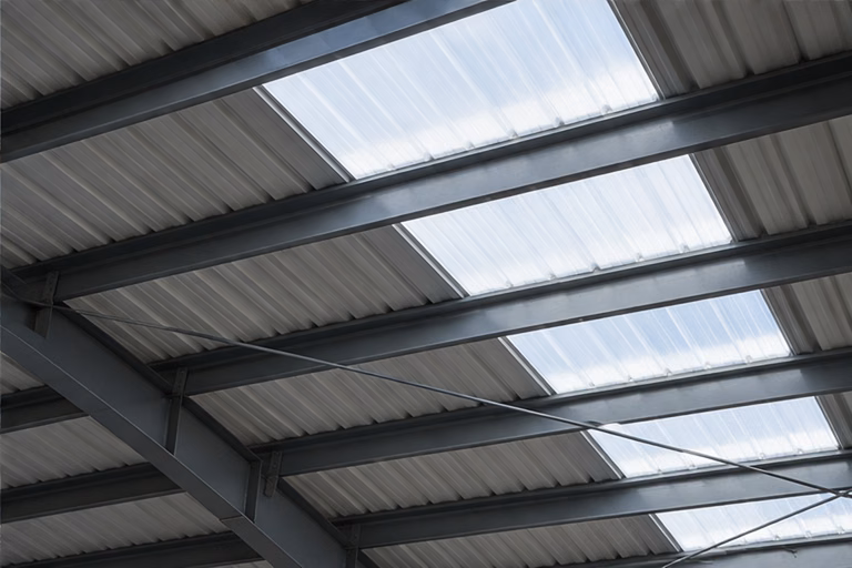 Translucent skylight strips between metal roof sheets